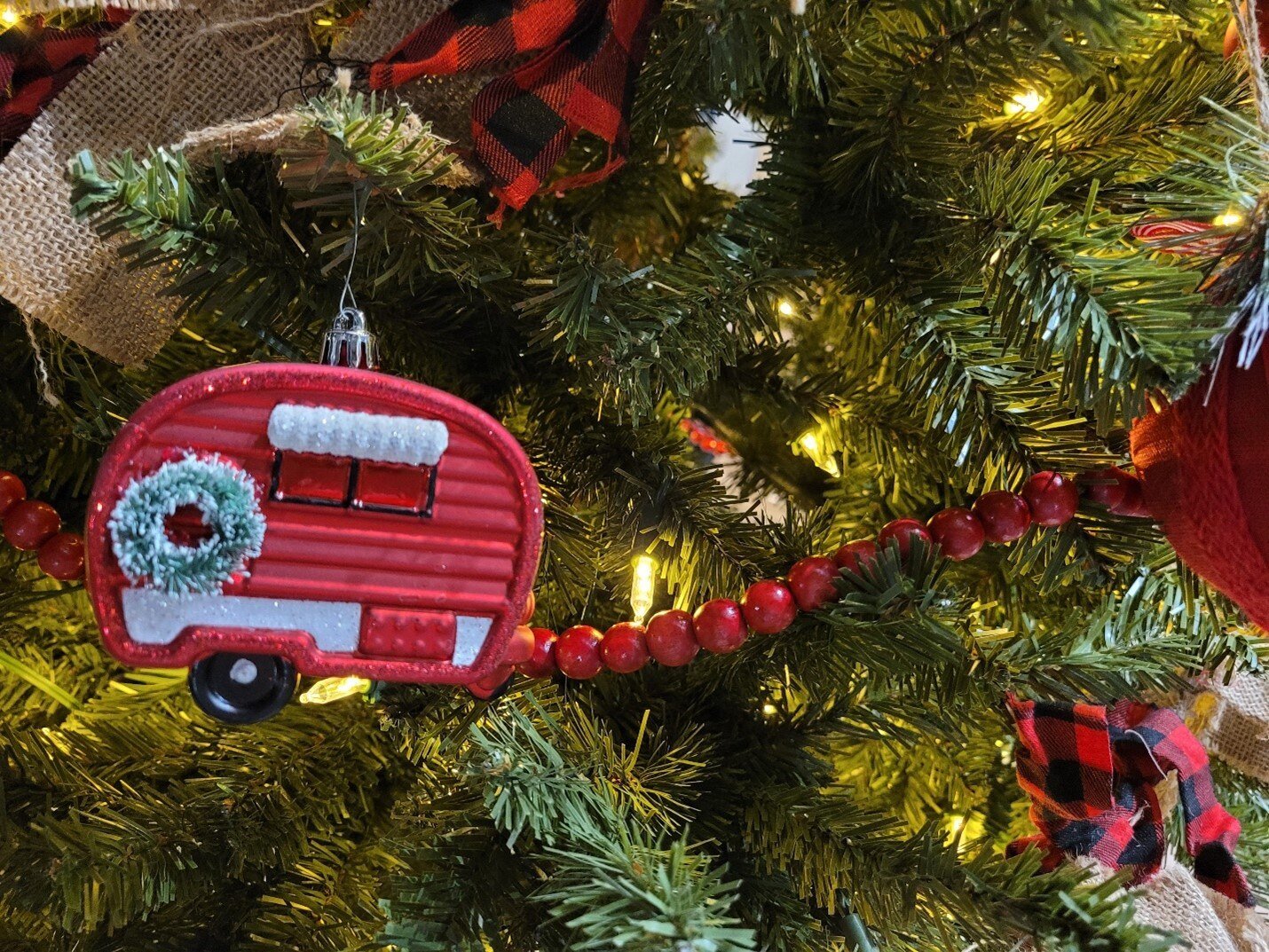 RV ornament hangs from Christmas tree