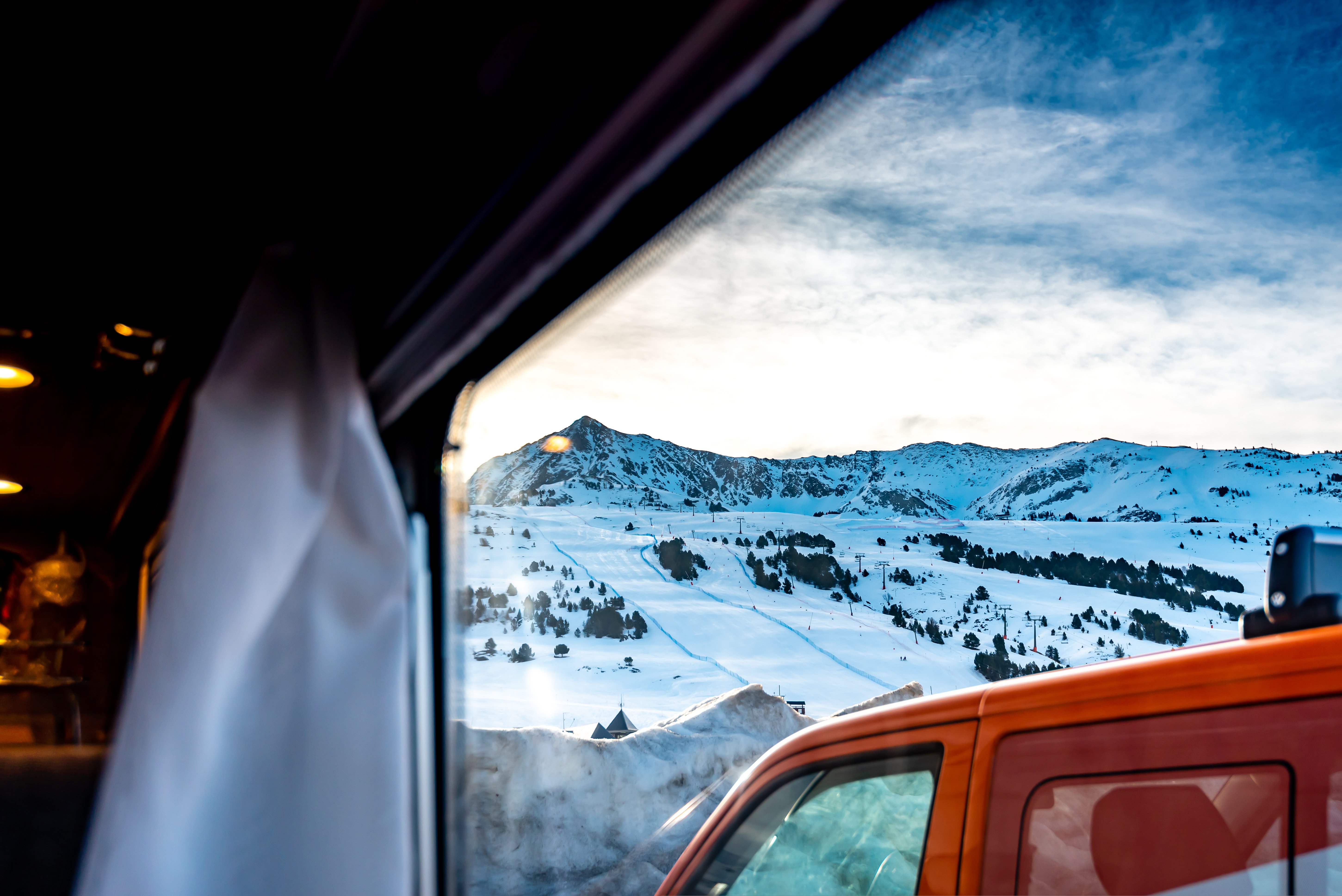 View of snow-covered mountains from an RV van